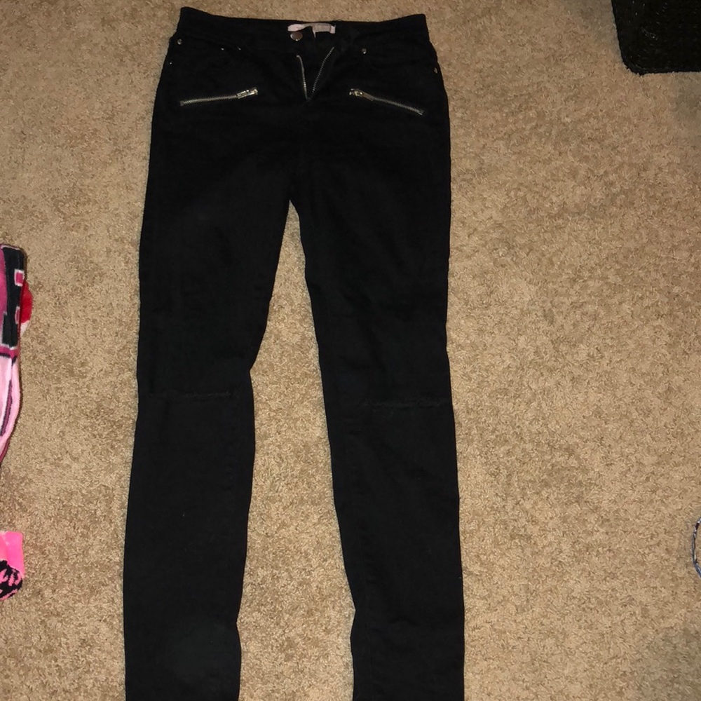 Black jeans with rips in the knees